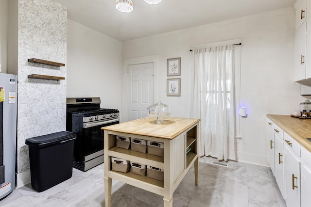 428 W S St, Benton, AR 72015 - kitchen featuring open shelves, stainless steel gas range, butcher block countertops, and white cabinetry