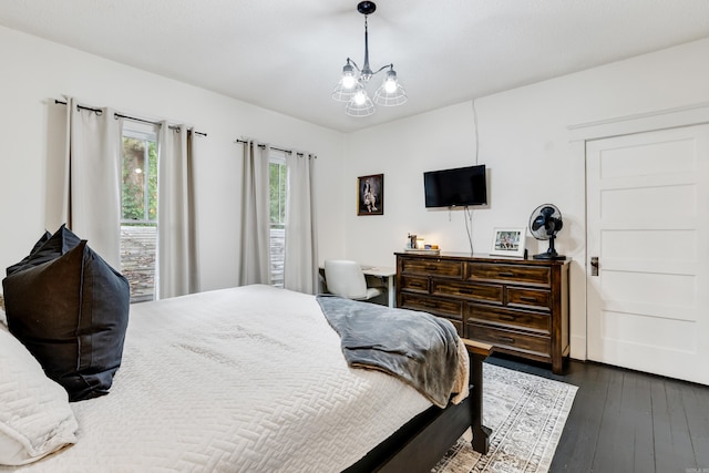 428 W S St, Benton, AR 72015 - bedroom with dark wood-style flooring and a chandelier