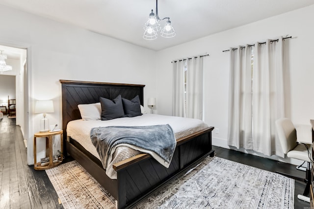 428 W S St, Benton, AR 72015 - bedroom featuring a chandelier, hardwood / wood-style floors, and baseboards