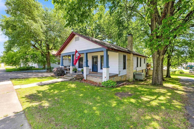 428 W S St, Benton, AR 72015 - bungalow-style home featuring cooling unit, a chimney, a porch, and a front yard