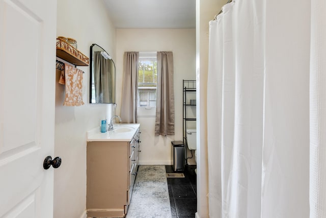 428 W S St, Benton, AR 72015 - bathroom featuring vanity, baseboards, and tile patterned flooring