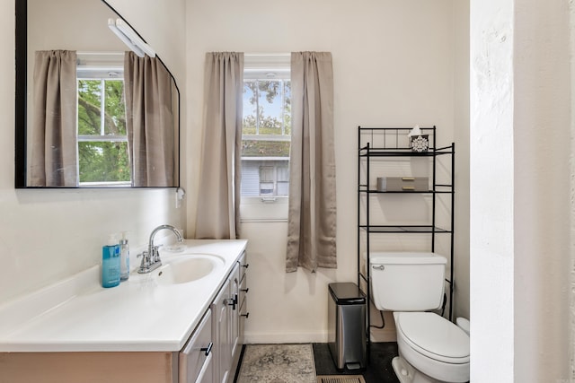 428 W S St, Benton, AR 72015 - bathroom featuring toilet, vanity, and baseboards