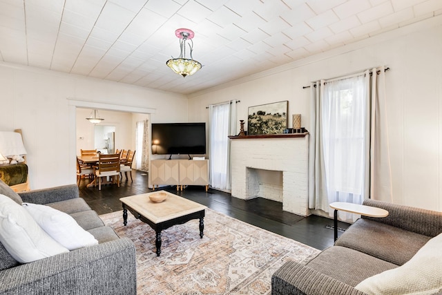 428 W S St, Benton, AR 72015 - living area featuring wood finished floors and a fireplace
