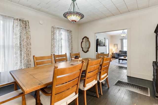 428 W S St, Benton, AR 72015 - dining room featuring crown molding and dark wood-style flooring