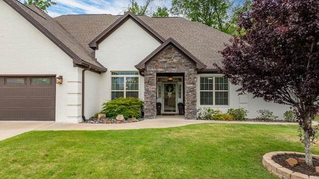 216 Lake Valley Dr, Maumelle, AR 72113 - view of front of property featuring a shingled roof, a front lawn, and brick siding