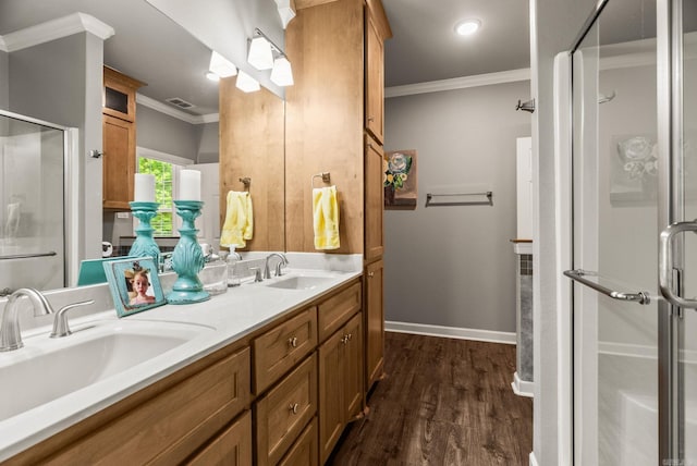 216 Lake Valley Dr, Maumelle, AR 72113 - full bath with ornamental molding, a shower stall, wood finished floors, double vanity, and baseboards