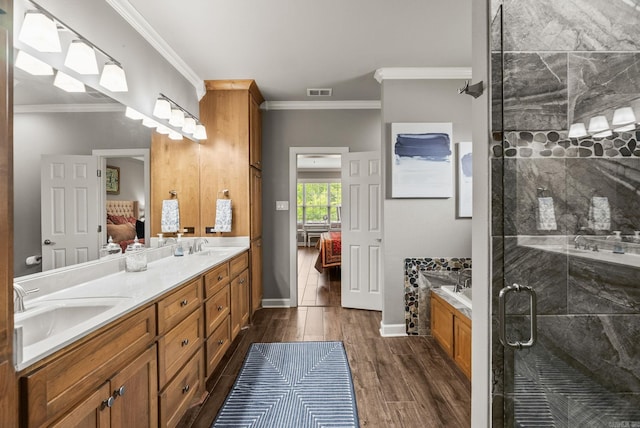 216 Lake Valley Dr, Maumelle, AR 72113 - ensuite bathroom featuring a shower stall, wood finished floors, ornamental molding, double vanity, and a bath