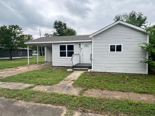 613 Paschal, Trumann, AR 72472 - view of front of property featuring a carport and a front yard