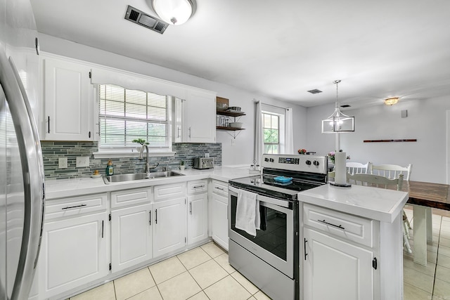 kitchen with stainless steel appliances, a sink, light tile patterned flooring, a peninsula, and open shelves