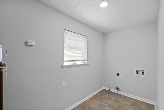 718 Coulter Rd, Sherwood, AR 72120 - clothes washing area with hookup for an electric dryer, hookup for a washing machine, a textured ceiling, baseboards, and hookup for a gas dryer