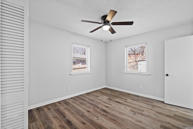 718 Coulter Rd, Sherwood, AR 72120 - unfurnished bedroom featuring wood finished floors, a textured ceiling, baseboards, and ceiling fan