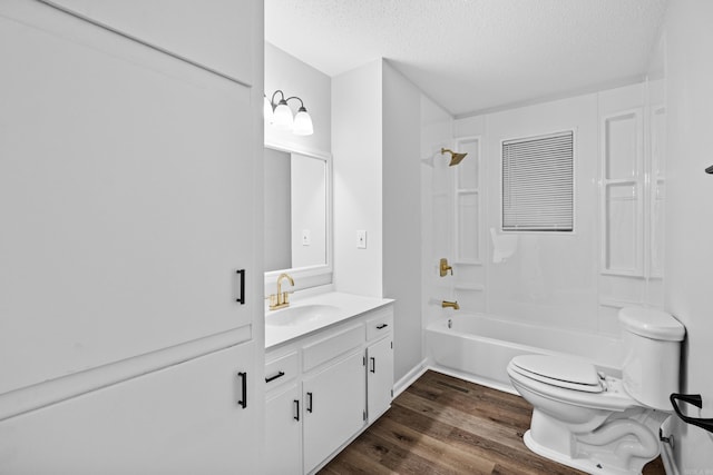 718 Coulter Rd, Sherwood, AR 72120 - full bath featuring toilet, vanity, a textured ceiling, wood finished floors, and shower / tub combination