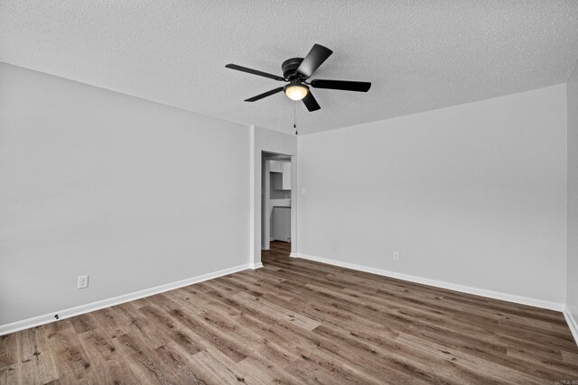 718 Coulter Rd, Sherwood, AR 72120 - empty room with wood finished floors, a textured ceiling, ceiling fan, and baseboards