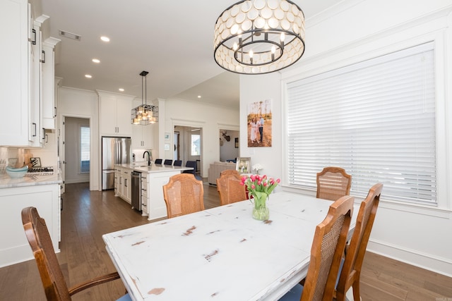 7021 Fields Dr, Alexander, AR 72019 - dining space featuring a chandelier, recessed lighting, ornamental molding, dark wood-style flooring, and baseboards