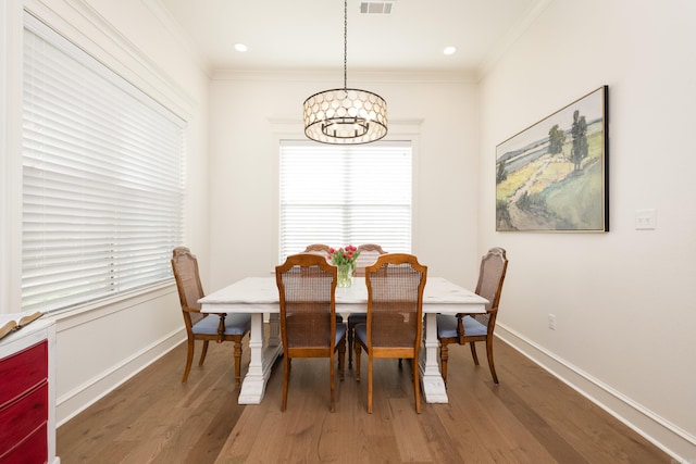 7021 Fields Dr, Alexander, AR 72019 - dining room featuring a chandelier, light wood-type flooring, ornamental molding, and baseboards