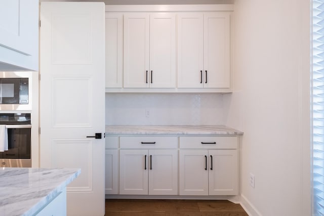 7021 Fields Dr, Alexander, AR 72019 - bar featuring stainless steel appliances and tasteful backsplash