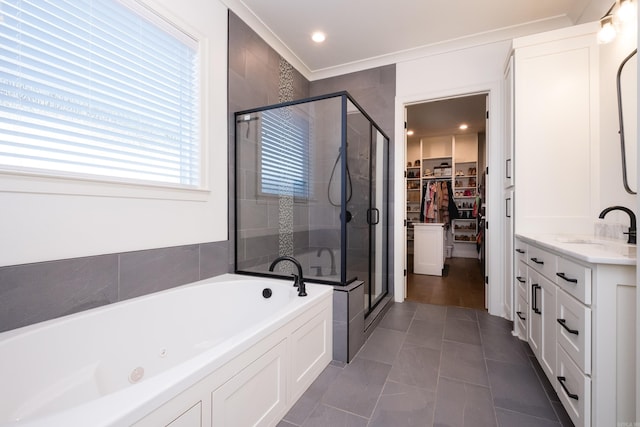 7021 Fields Dr, Alexander, AR 72019 - full bath with a stall shower, a walk in closet, a garden tub, vanity, and crown molding