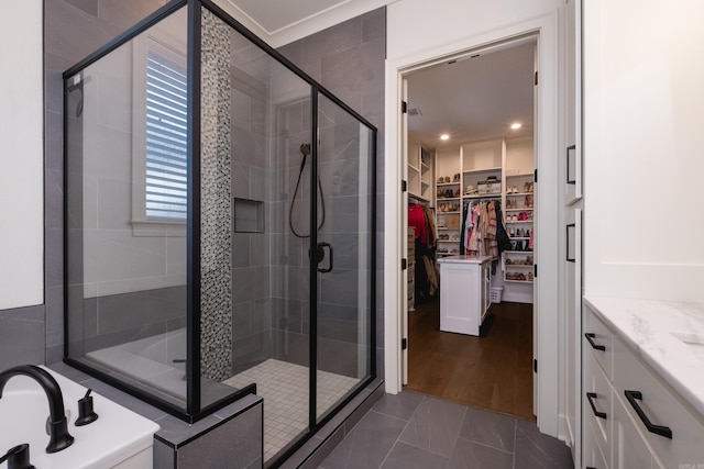 7021 Fields Dr, Alexander, AR 72019 - bathroom featuring a shower stall, a spacious closet, vanity, and a tub
