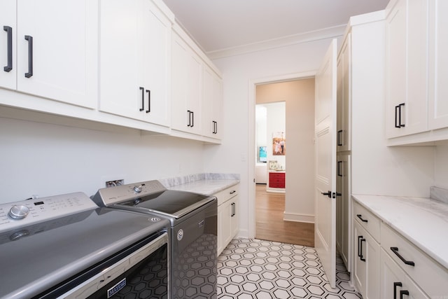 7021 Fields Dr, Alexander, AR 72019 - clothes washing area with cabinet space and separate washer and dryer