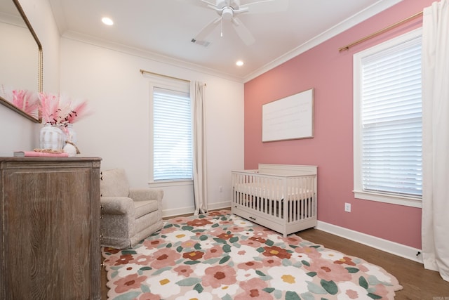 7021 Fields Dr, Alexander, AR 72019 - bedroom featuring a crib, crown molding, wood finished floors, baseboards, and recessed lighting