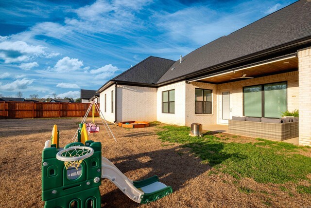 7021 Fields Dr, Alexander, AR 72019 - view of yard featuring fence, a playground, and an outdoor living space
