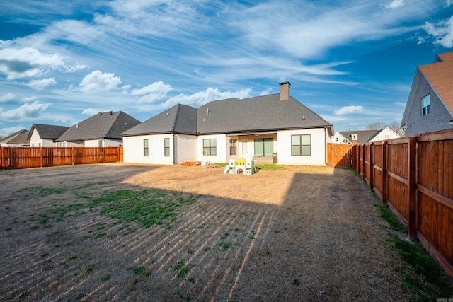 7021 Fields Dr, Alexander, AR 72019 - back of property featuring a chimney, a fenced backyard, and stucco siding