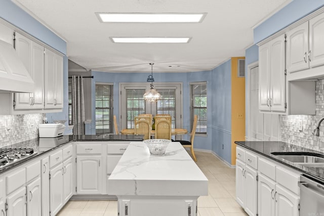 9 Leeward Ct, Maumelle, AR 72113 - kitchen with a sink, a peninsula, plenty of natural light, and appliances with stainless steel finishes