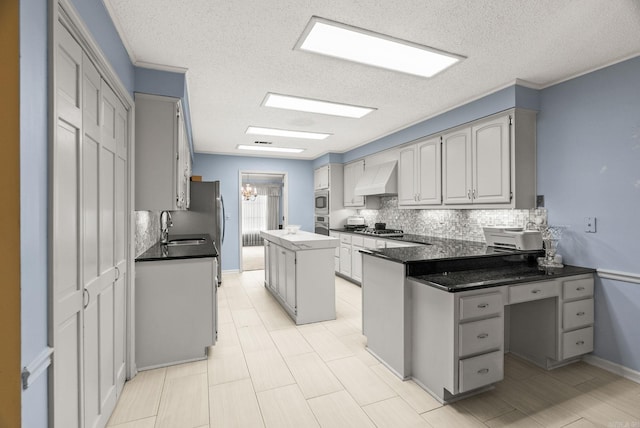 9 Leeward Ct, Maumelle, AR 72113 - kitchen with custom exhaust hood, appliances with stainless steel finishes, tasteful backsplash, a sink, and a textured ceiling