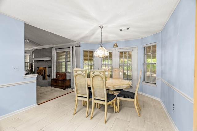 9 Leeward Ct, Maumelle, AR 72113 - dining space featuring plenty of natural light, a chandelier, and baseboards