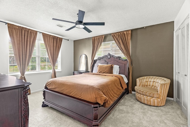 9 Leeward Ct, Maumelle, AR 72113 - bedroom featuring carpet, a closet, a textured ceiling, a ceiling fan, and baseboards