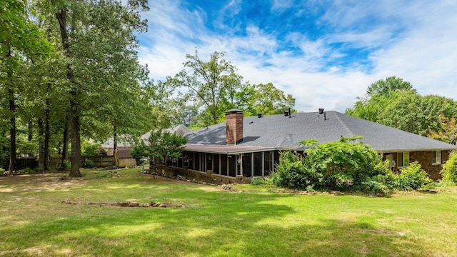 9 Leeward Ct, Maumelle, AR 72113 - rear view of house with a sunroom and a chimney
