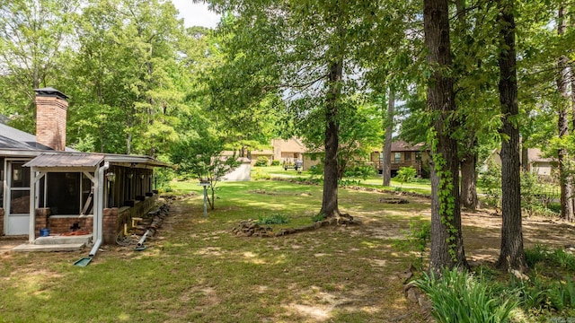 9 Leeward Ct, Maumelle, AR 72113 - view of green lawn with a sunroom