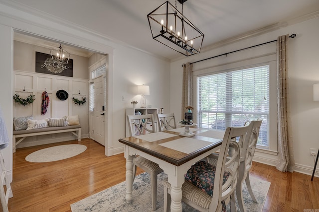 4715 Stockton Rd, Conway, AR 72034 - dining room with a chandelier, ornamental molding, and light wood-type flooring