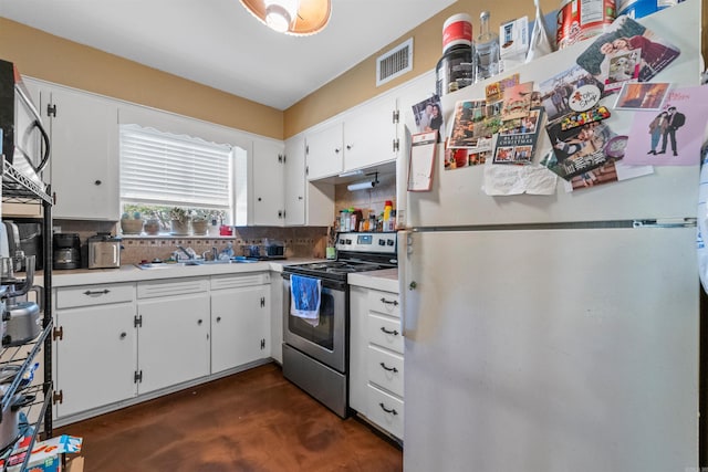 1217 Look St, Little Rock, AR 72204 - kitchen featuring freestanding refrigerator, stainless steel electric range oven, tasteful backsplash, light countertops, and a sink