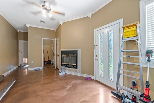 1217 Look St, Little Rock, AR 72204 - entrance foyer with concrete floors, crown molding, a ceiling fan, baseboards, and a glass covered fireplace