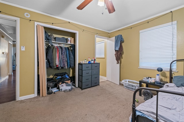 1217 Look St, Little Rock, AR 72204 - bedroom featuring ornamental molding, a closet, carpet floors, baseboards, and a ceiling fan