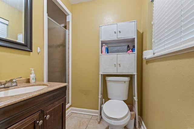1217 Look St, Little Rock, AR 72204 - full bath featuring a stall shower, tile patterned floors, toilet, vanity, and baseboards