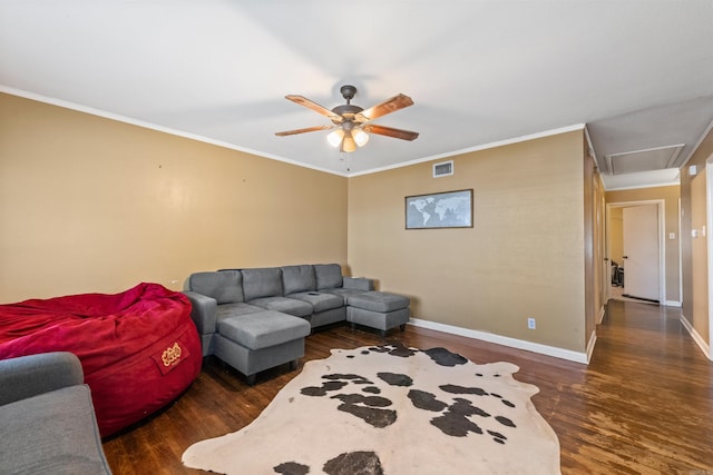 1217 Look St, Little Rock, AR 72204 - living area with dark wood-type flooring, ornamental molding, a ceiling fan, baseboards, and attic access