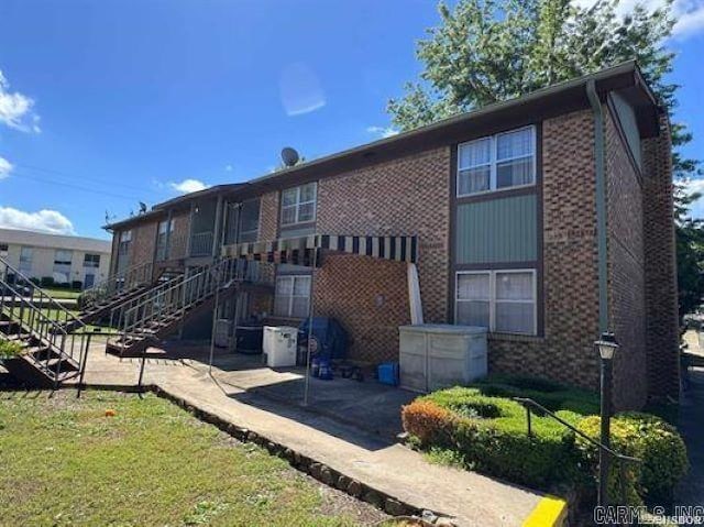 600 Higdon Ferry Rd Unit 203, Hot Springs, AR 71913 - back of property with stairs, a patio area, and brick siding