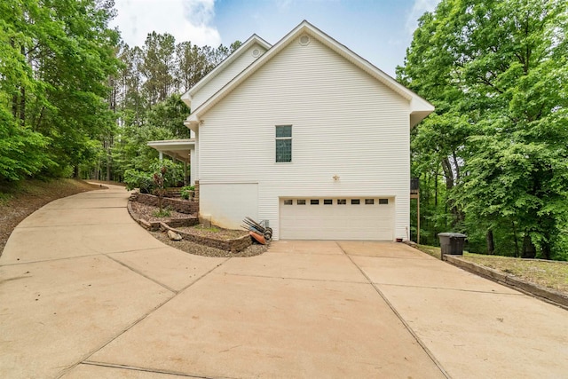 7 Galope Pl, Hot Springs Village, AR 71909 - view of home's exterior featuring a garage and concrete driveway