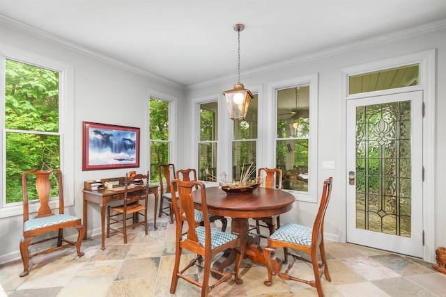 7 Galope Pl, Hot Springs Village, AR 71909 - dining area featuring stone tile floors, healthy amount of natural light, and crown molding