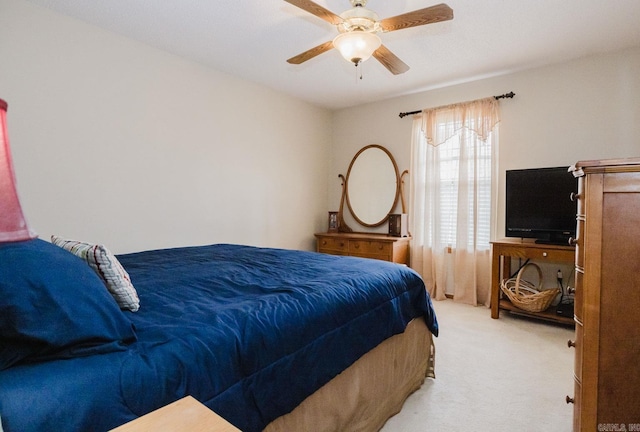 carpeted bedroom with a ceiling fan