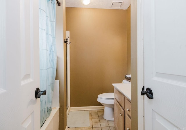 full bath with a shower with shower curtain, toilet, vanity, tile patterned floors, and baseboards