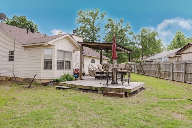 back of property with a deck, outdoor dining space, and a chimney