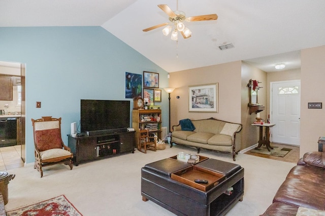 living area featuring lofted ceiling, ceiling fan, baseboards, and light carpet