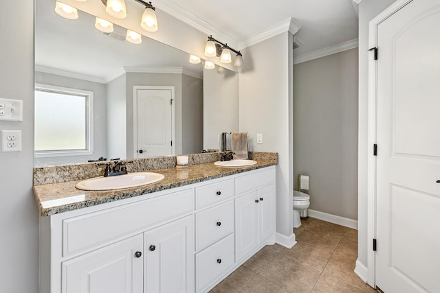 bathroom featuring toilet, crown molding, double vanity, baseboards, and tile patterned floors