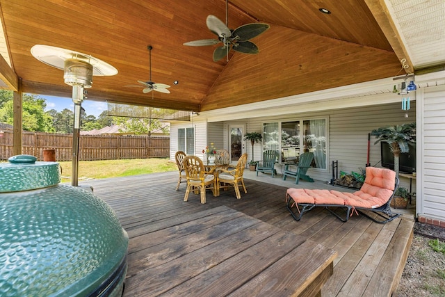 deck with fence, ceiling fan, and outdoor dining space