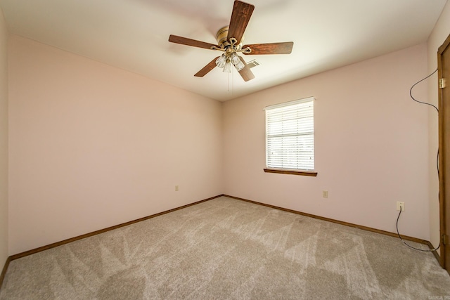 empty room with light carpet, baseboards, and a ceiling fan