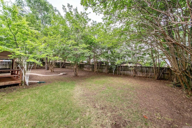 view of yard with a wooden deck