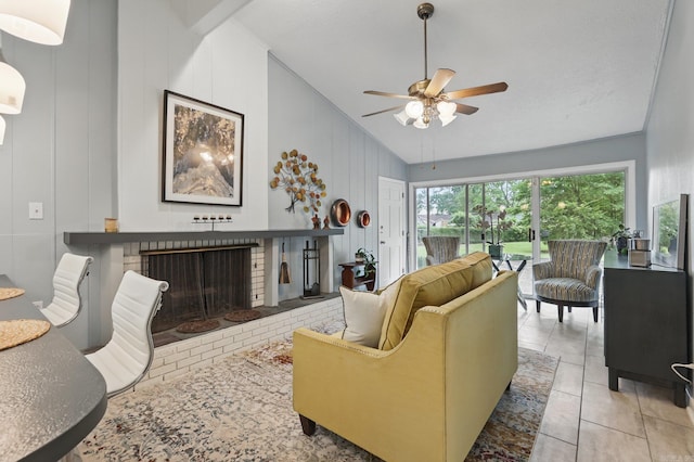 717 Choctaw Cir, Little Rock, AR 72205 - living area with lofted ceiling, a brick fireplace, ceiling fan, and light tile patterned flooring